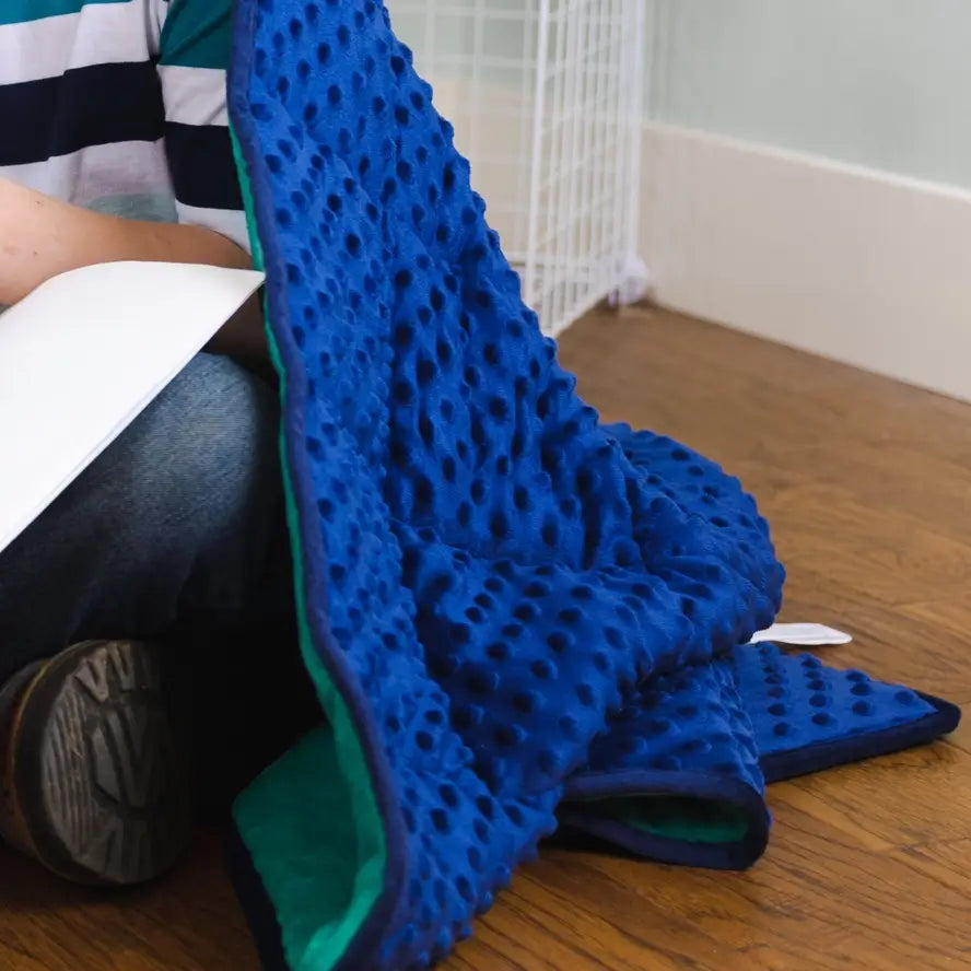 An up-close look at the minky texture of the Bouncyband Kids Soft Fleece Sensory Weighted Blanket - 7 lb.