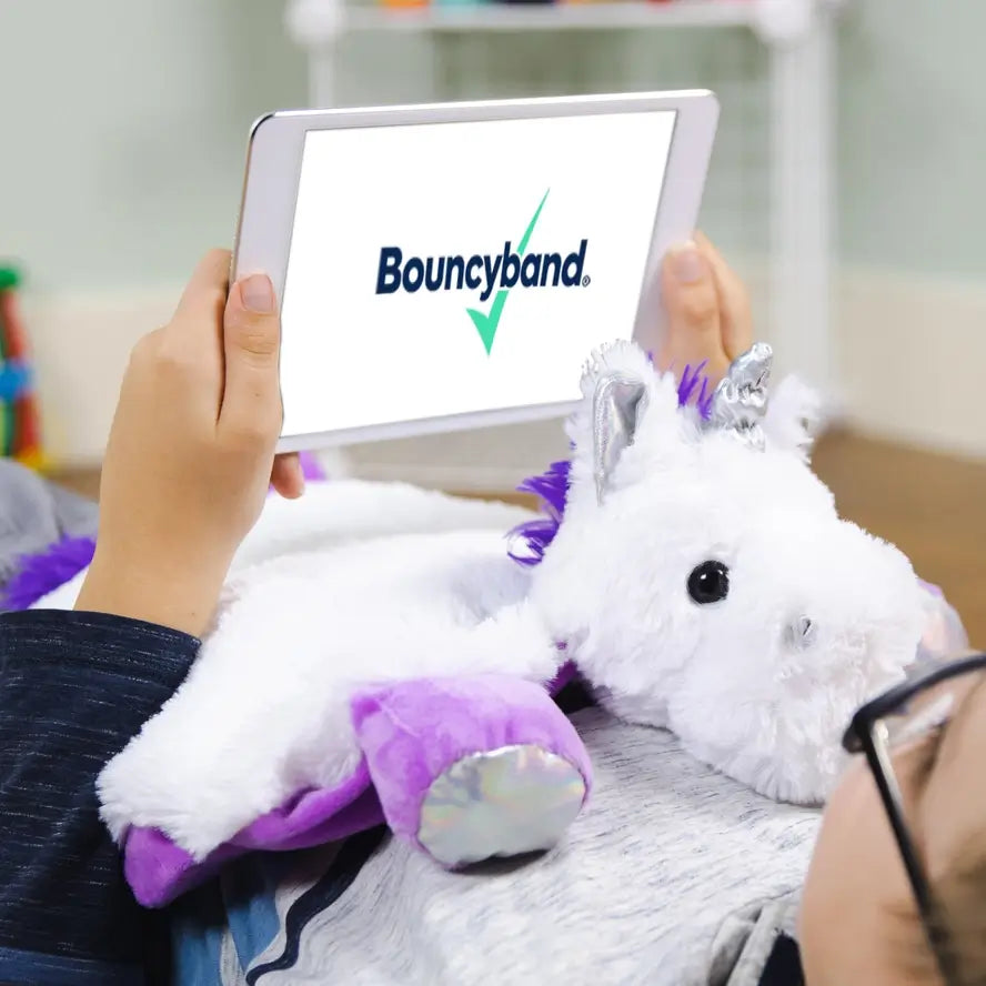 The Weighted Washable Lap Pad Unicorn providing calm on a child's chest.