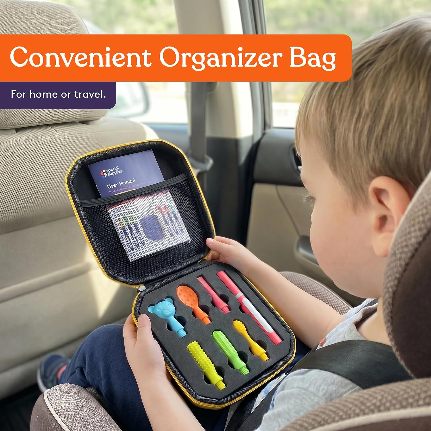 A child holds Pink Buzz Buddy Oral Stimulation Kit with 6 Soft Textured Interchangeable Heads in its organizer bag.