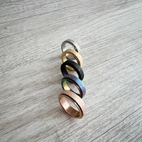 Various colors of the Sweettine Chrome Fidget Rings.