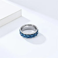 The Cogwheel Fidget Ring in Silver and Blue.
