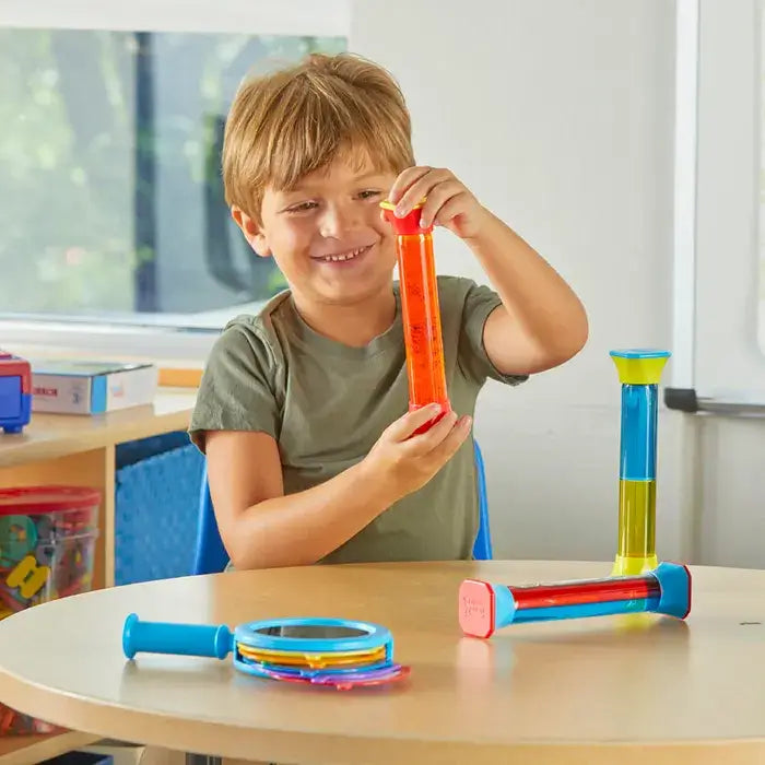 A child holding up a Colormix Sensory Tube.