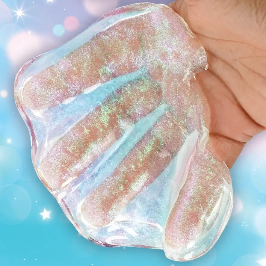 A hand holds the Crazy Aaron's Get Ready With Me Thinking Putty in a way that reveals the shimmering opalescence of the putty.