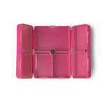 The open magenta Everything's Fine Pill and Vitamin Case.