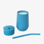 The three separate components of the EZPZ Blue Cup + Straw System for Toddlers.