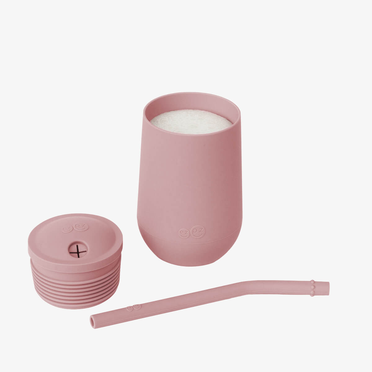 The cup, lid, and straw of the EZPZ Blush Cup + Straw System.