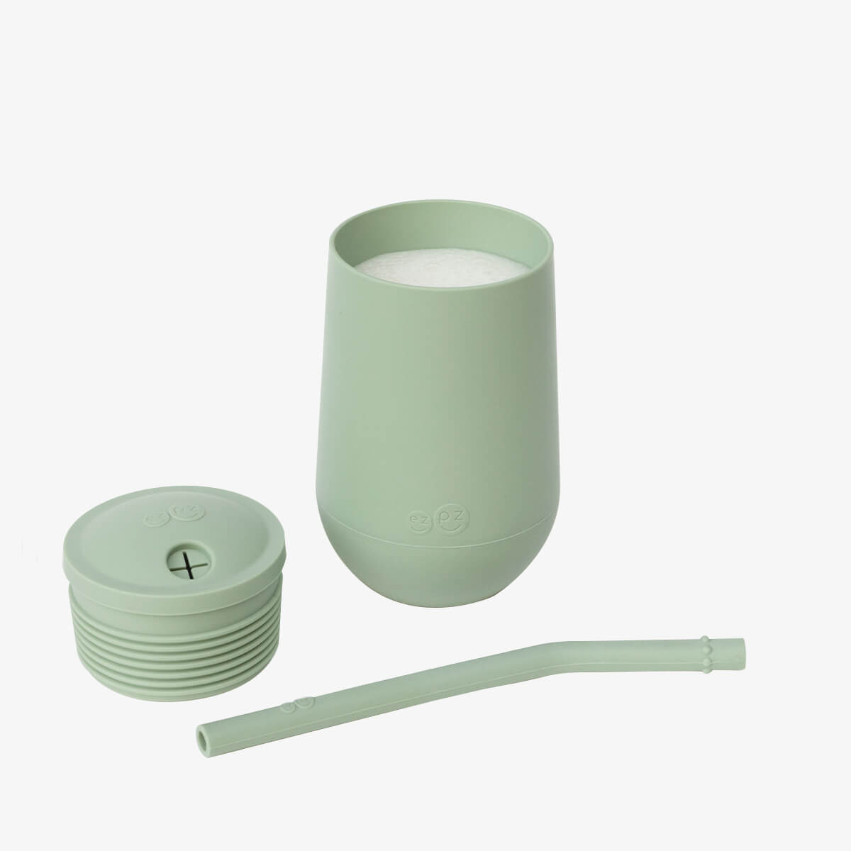 The three separate components of the EZPZ Sage Cup + Straw System for Toddlers.