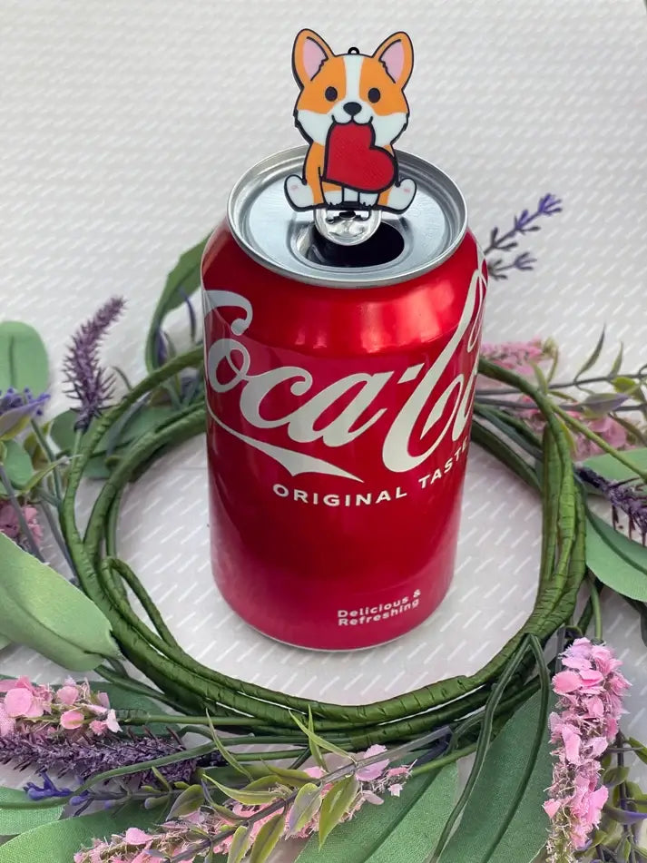 The Cupid Corgi Soda Tab Buddy on a Coke can.