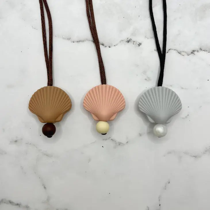 The variants of the Shell Chewy Fidget Necklace.