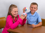 Two children hold up the Duncan Color Shift Puzzle Ball at a table.