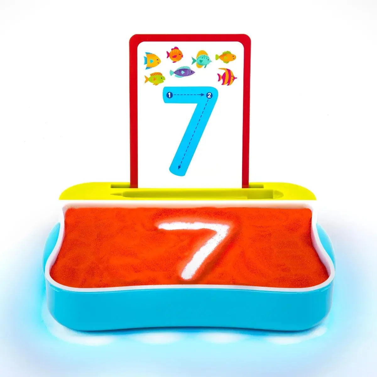 A number 7 is displayed on a card above a light-up table with orange sand in which someone has written a 7.