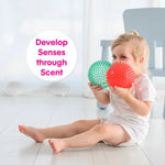 A child holds both spiky balls and text reads: develop senses through scent.