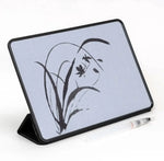The Buddha Board Enso with a botanical water drawing.