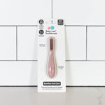 The Blush ezpz Baby-Led Toothbrush in its product packaging.