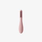 The Blush ezpz Baby-Led Toothbrush.