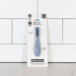 The Indigo ezpz Baby-Led Toothbrush in its product package.