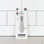 The Pewter ezpz Baby-Led Toothbrush in its product package.