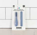 The Indigo ezpz Baby-Led Toothbrush and Tongue Depressor Combo in its product packaging.