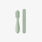 The back of the Sage ezpz Baby-Led Toothbrush and Tongue Depressor Combo.