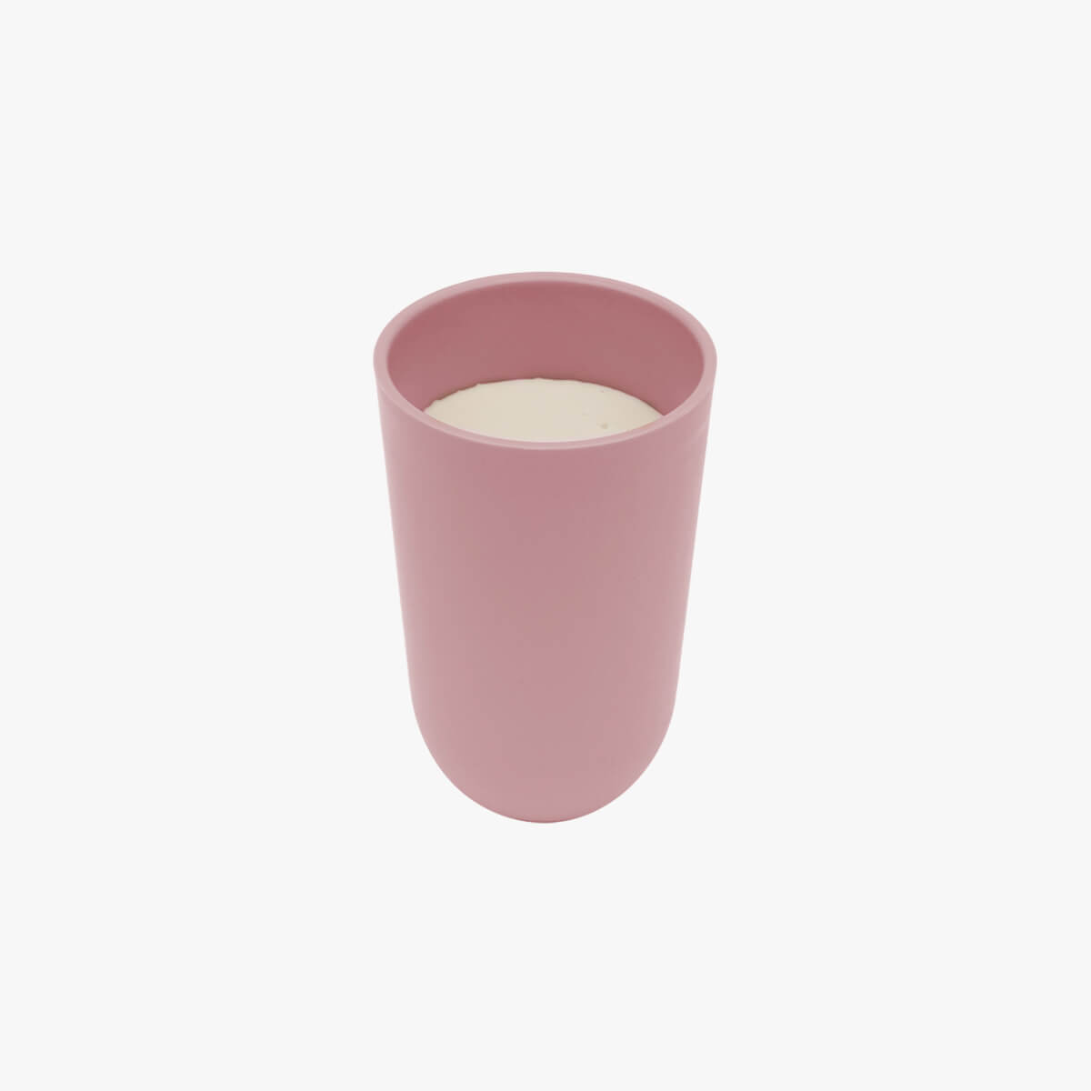 The cup portion of the Blush 14 oz Cup + Lid, full of milk.