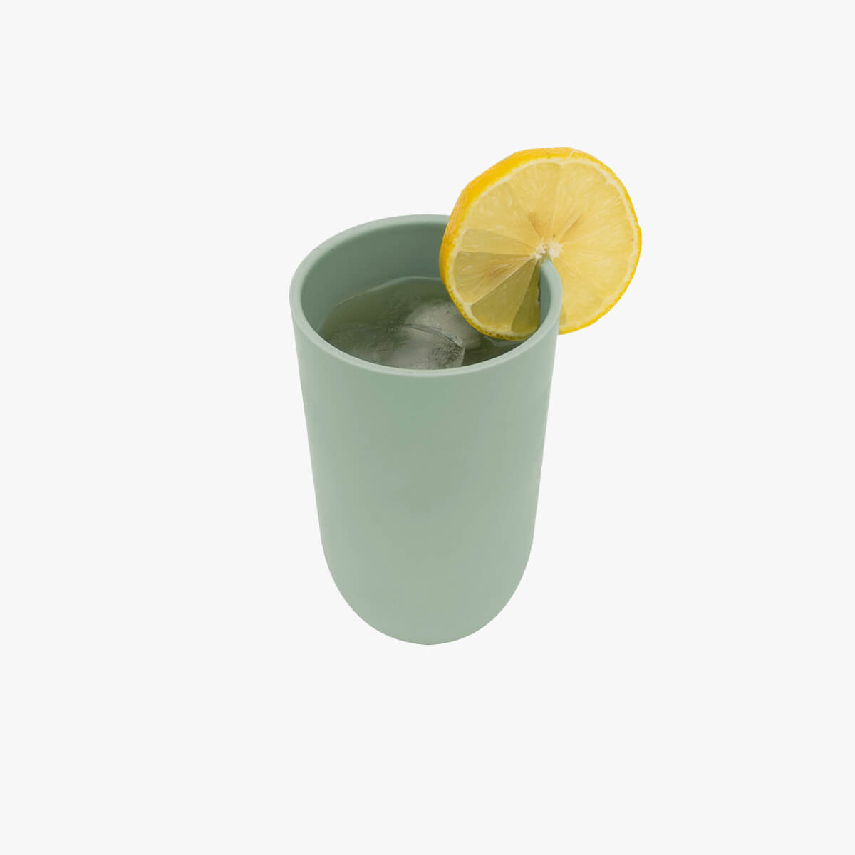 The Sage cup from the 14 oz Cup + Lid with a slice of lemon on its lip.