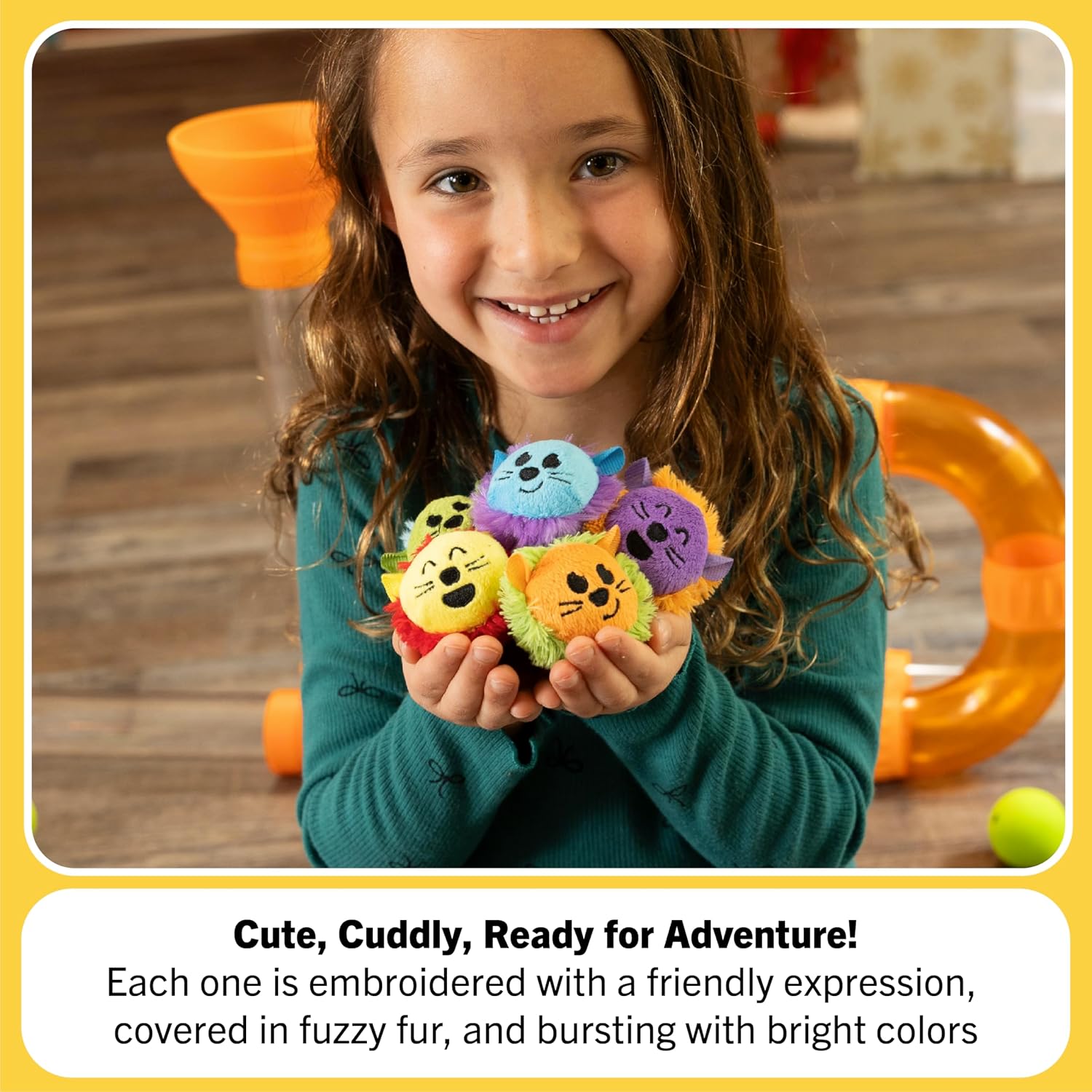 A child holds up the five Air Toobz Toobzters so that the expressions are visible.