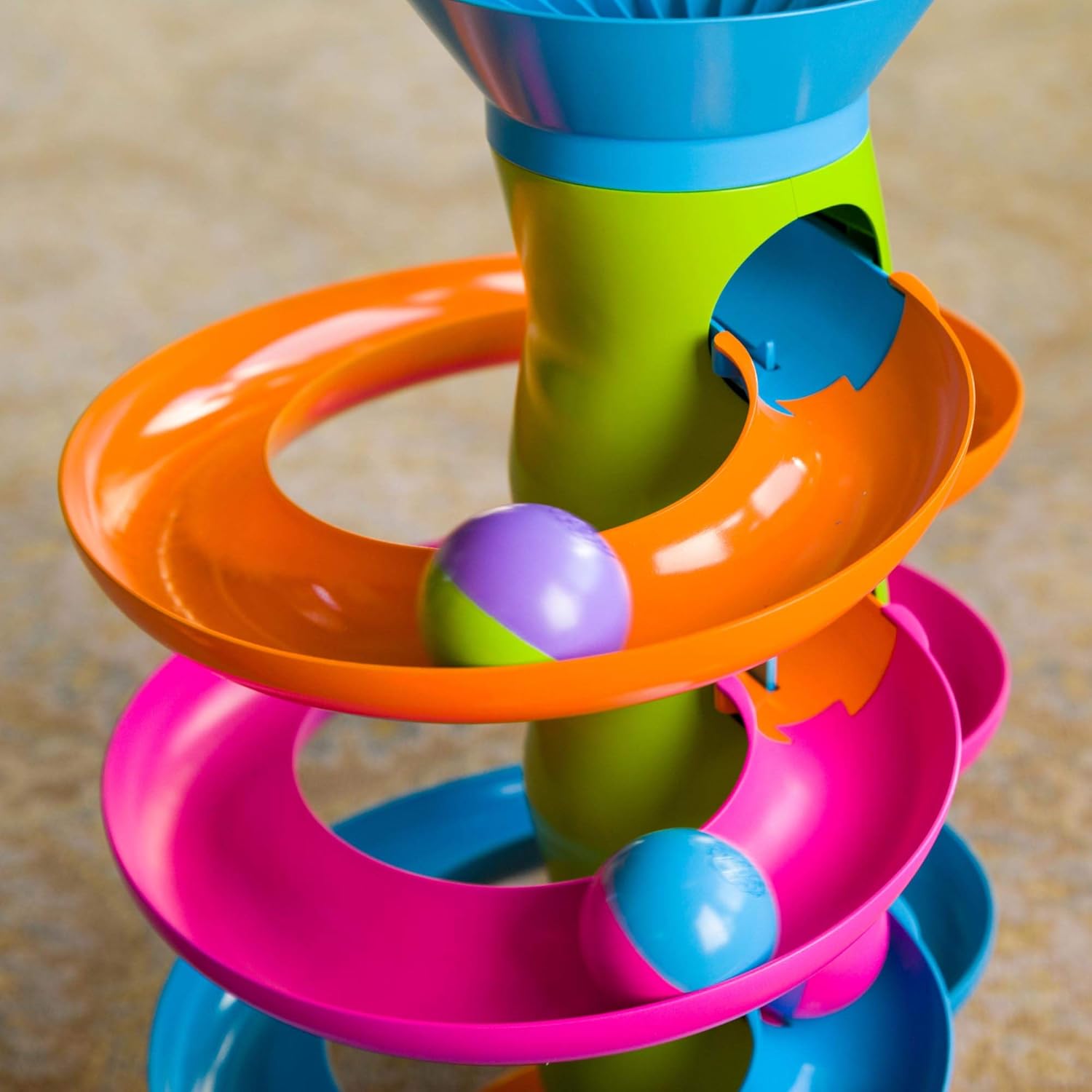 The colorful balls fall down the RollAgain Tower.