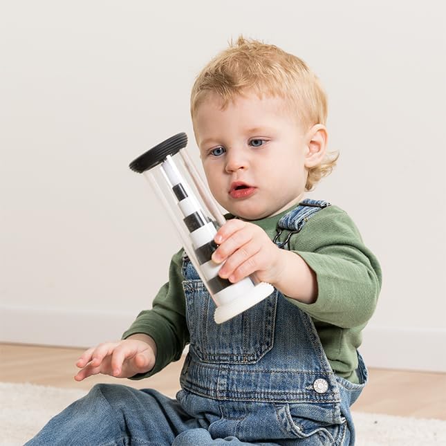 A child holds up the Flipty while in black and white mode.