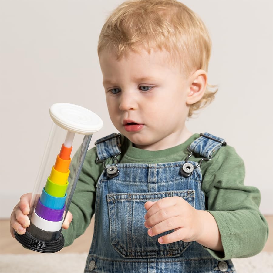 A child holds up the Flipty while in rainbow mode.