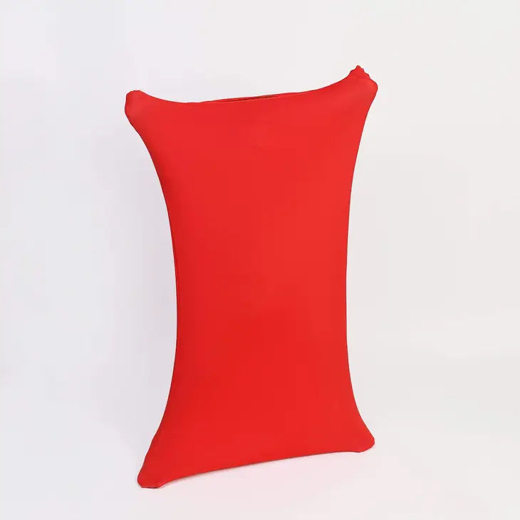 A child in a Red Body Sock has the extremities of the sock pulled out so far that they are not visible. The Red Body Sock looks like a sheet.
