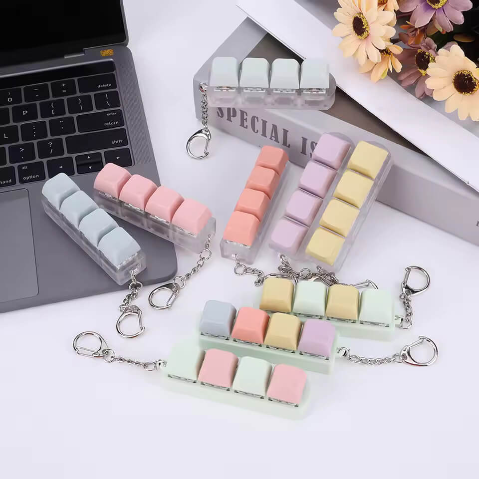 A variety of Keyboard Fidget Keychains.