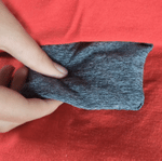 An animated GIF of the fidget pouch in the Youth Fidget Hoodie.