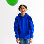 A child wears the Relaxing Royal Blue Youth Fidget Hoodie.