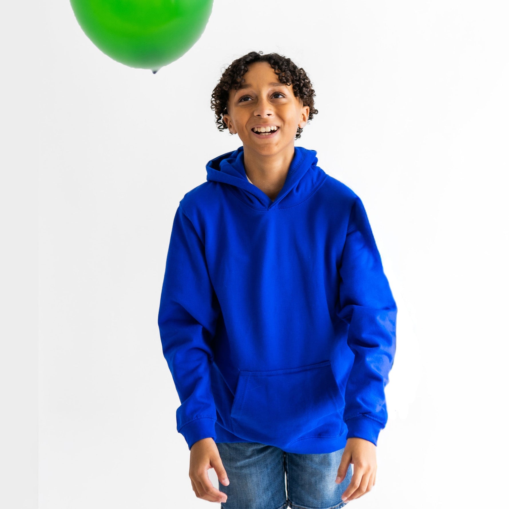 A child wears the Relaxing Royal Blue Youth Fidget Hoodie.