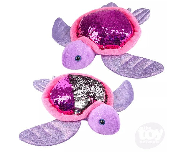 Two Flip Sequin Sea Turtles are posed in opposite directions. The top sea turtle has a shell that is all pink, and the one below it has a shell that is half pink and half silver.