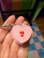 The As If Conversation Heart Fidget Clicker Keychain.