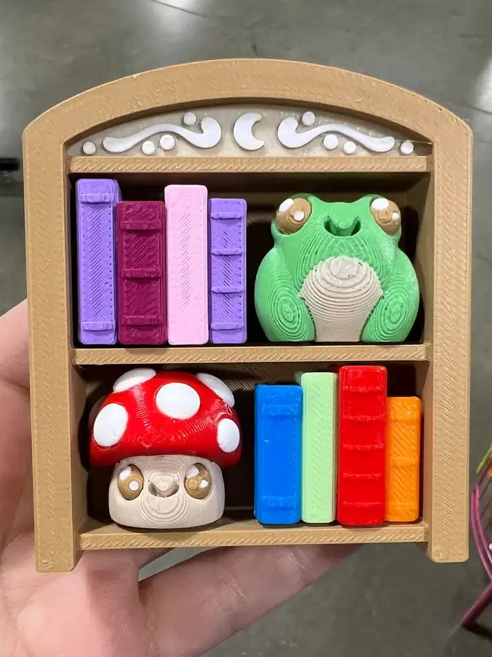 Frog and Mushroom Bookshelf 2x2 Fidget Clicker Keychain.
