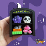 Spooky Oddities Bookshelf 2x2 Fidget Clicker Keychain.