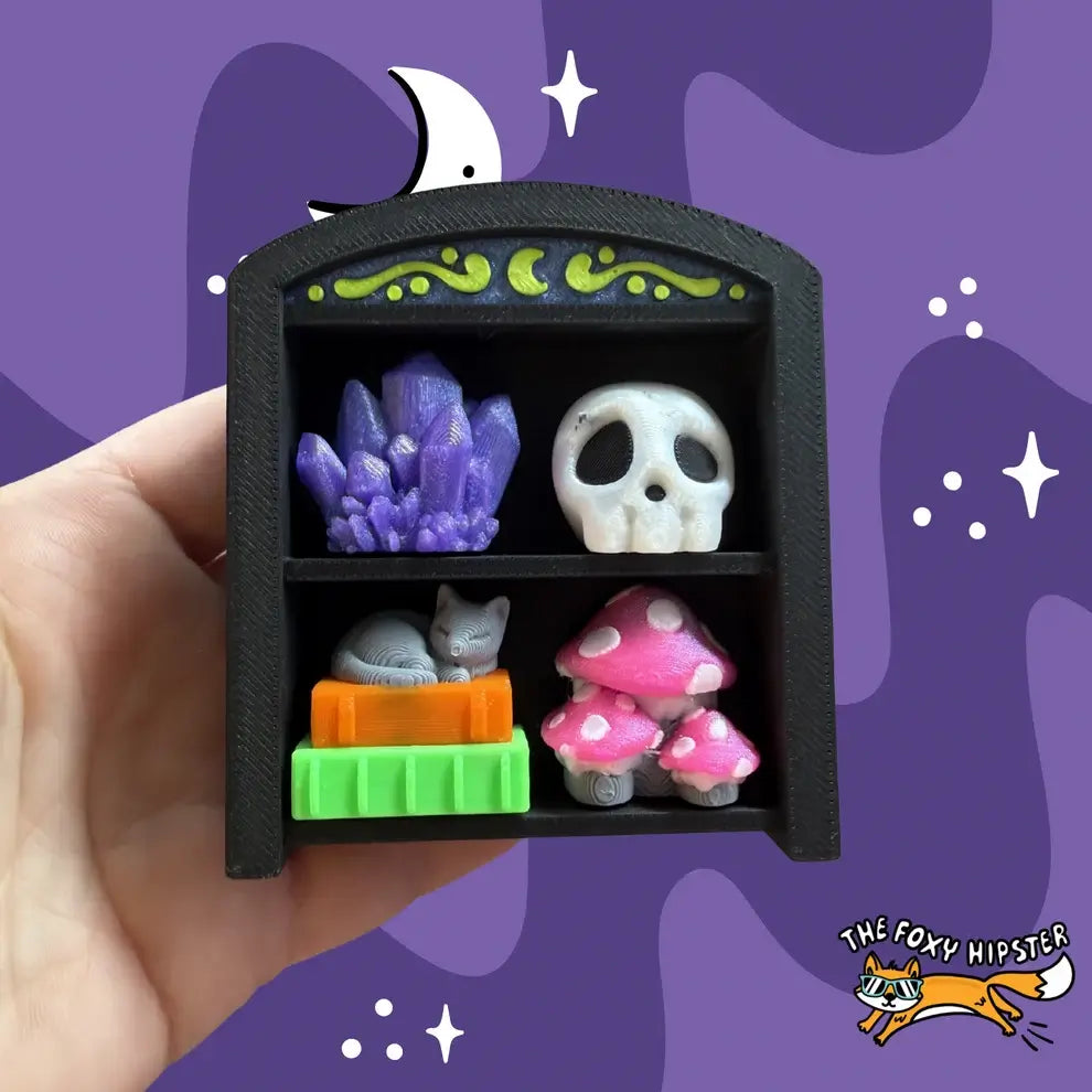 Spooky Oddities Bookshelf 2x2 Fidget Clicker Keychain.
