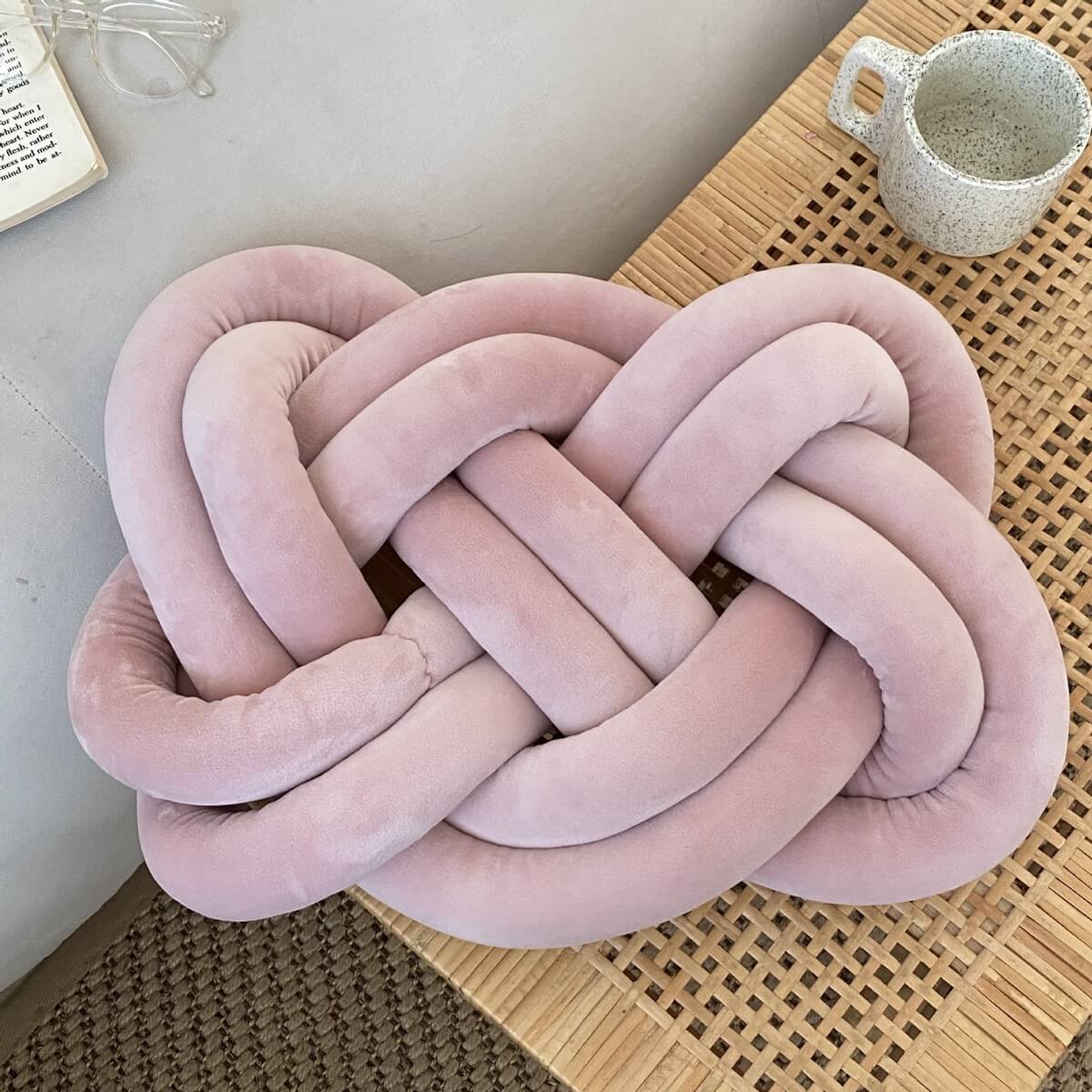 The Mauve Fried Dough Twist Plush Sensory Pillow.
