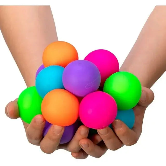 Two hands hold up colorful Gobs of Globs Teenie Nee Doh.