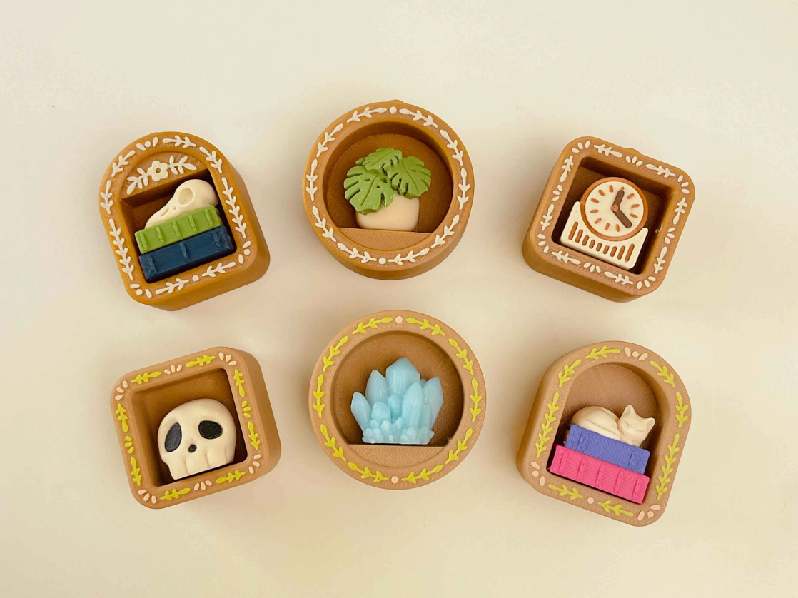 Six variants of the Mini Book Nook Fidget Clickers.