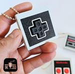 The Directional Pad Retro Game Controller Fidget Clicker Keychain.