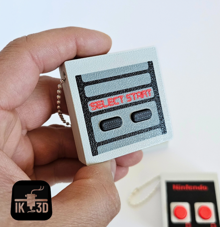 The Select/Start Retro Game Controller Fidget Clicker Keychain.