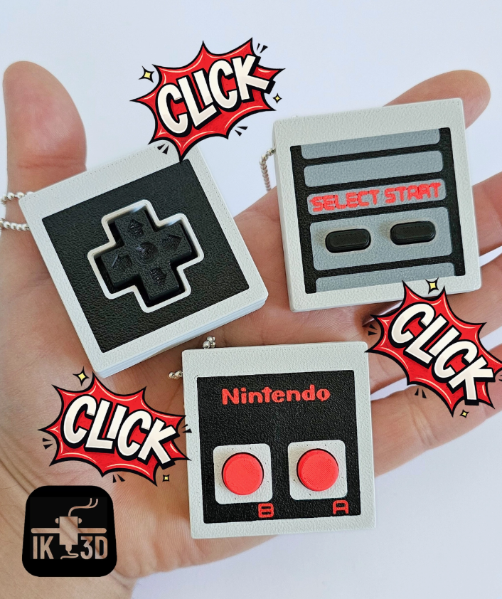 The 3 variants of Retro Game Controller Fidget Clicker Keychains.