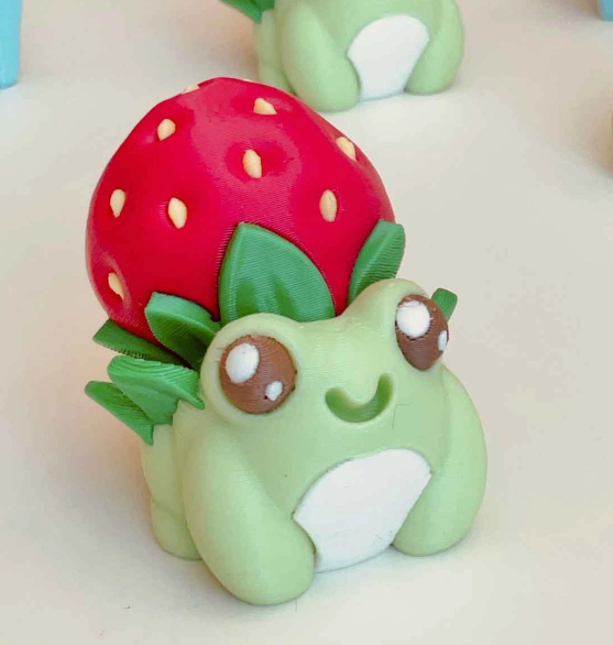 The Strawberry Frog Clicker Fidget Keychain.