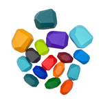 A pile of the 16-Piece Wooden Balancing Stone Stacking Blocks in Primary Colors.