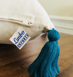 A close-up look at the tassel on the pillow cover.