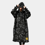 Someone pulls the eye mask part of the hood down to model the Dice Hideout Hoodie.