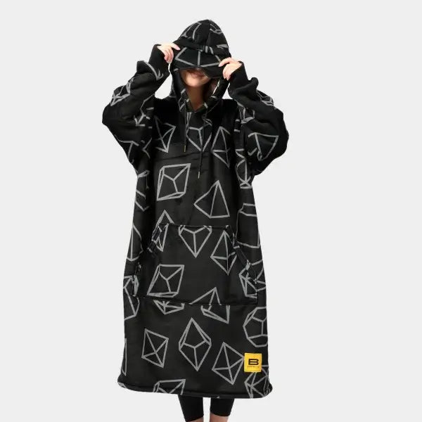 Someone pulls the eye mask part of the hood down to model the Dice Hideout Hoodie.